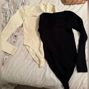 Ribbed long sleeve bodysuits size small, ivory and black